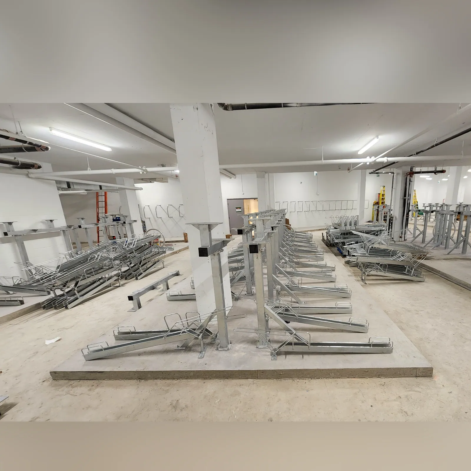 Bicycle storage racks installed across a parking level