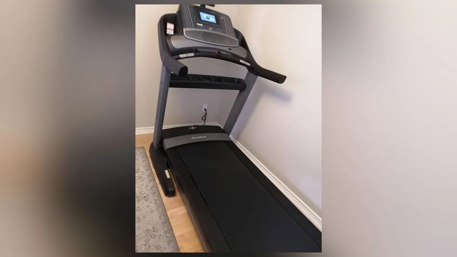 Treadmill assembled and levelled in a home gym