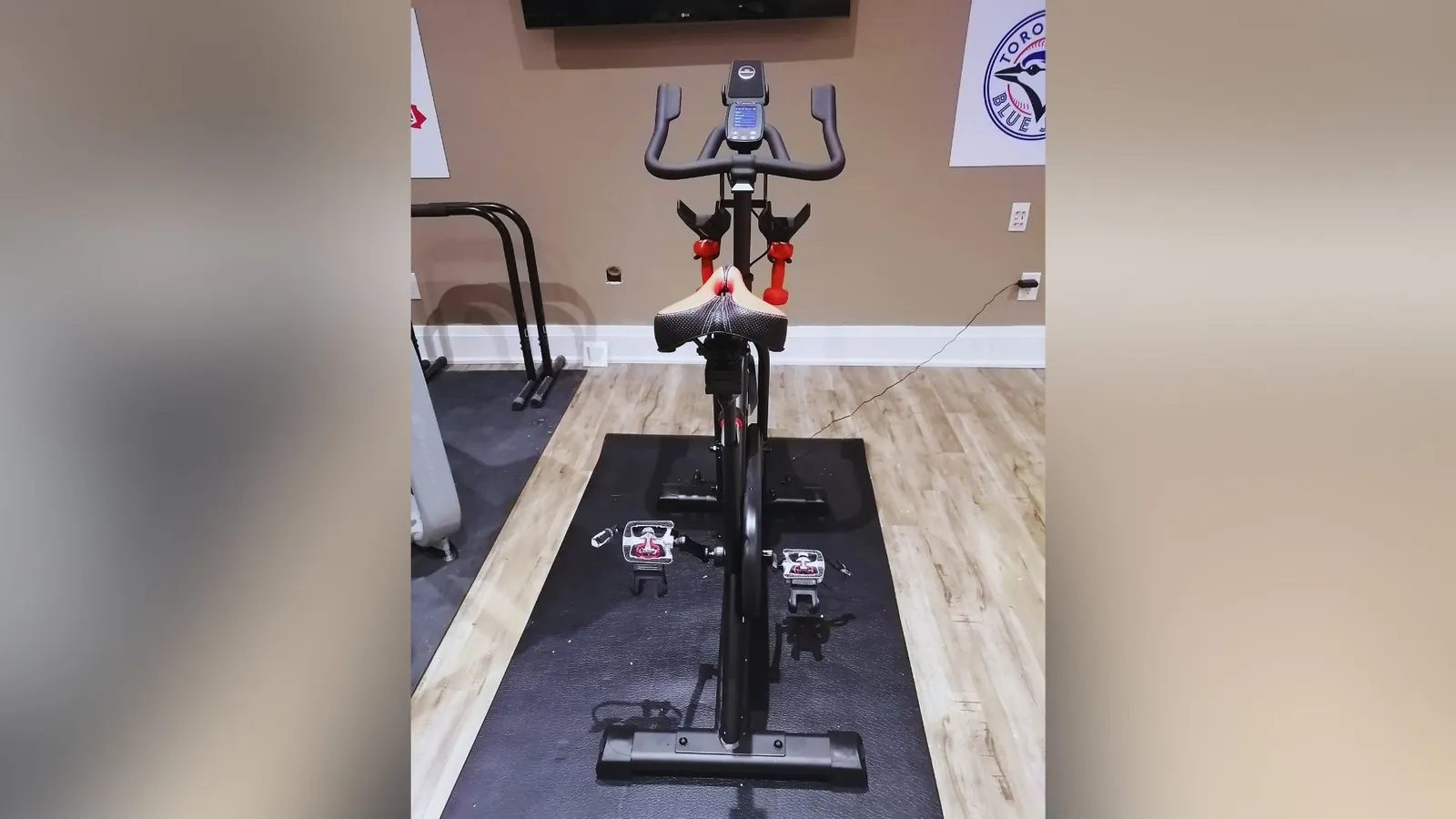 Spin bike assembled and levelled in a home gym