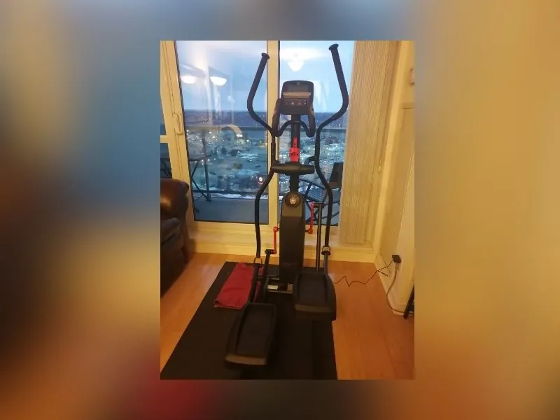 Treadmill assembled and levelled in a home gym