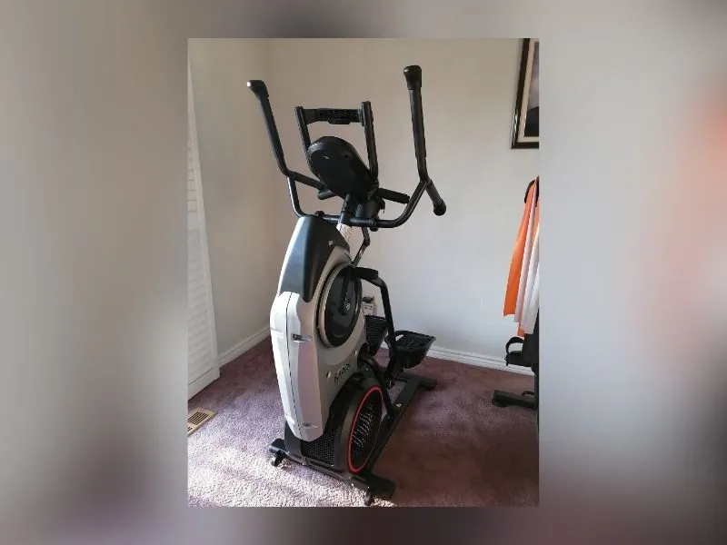 Elliptical trainer built and levelled on a gym floor
