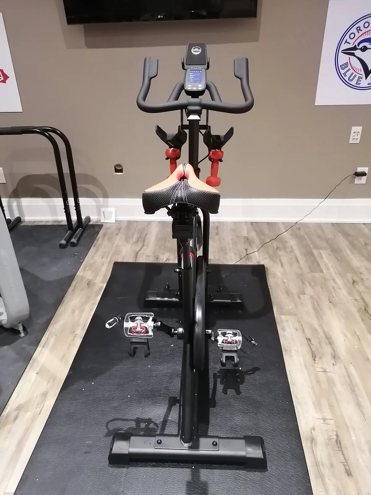 Spin bike assembled and levelled in a home gym