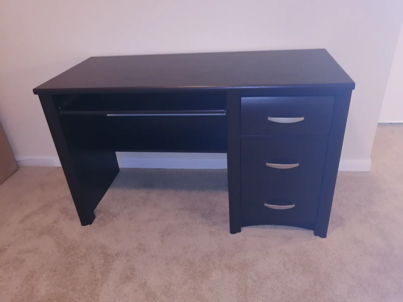 Storage bed frame assembled and squared in a bedroom