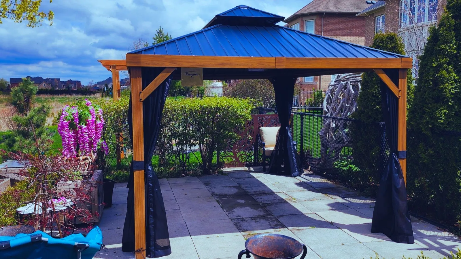 Hardtop gazebo installed in a GTA backyard