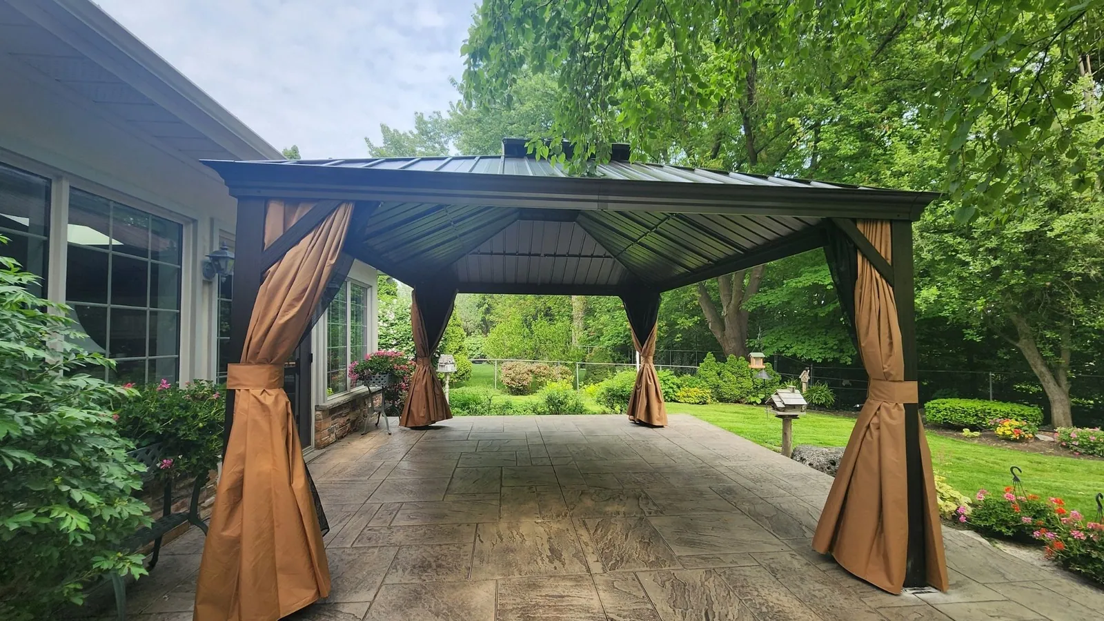 Gazebo with mosquito netting installed in a Brampton backyard
