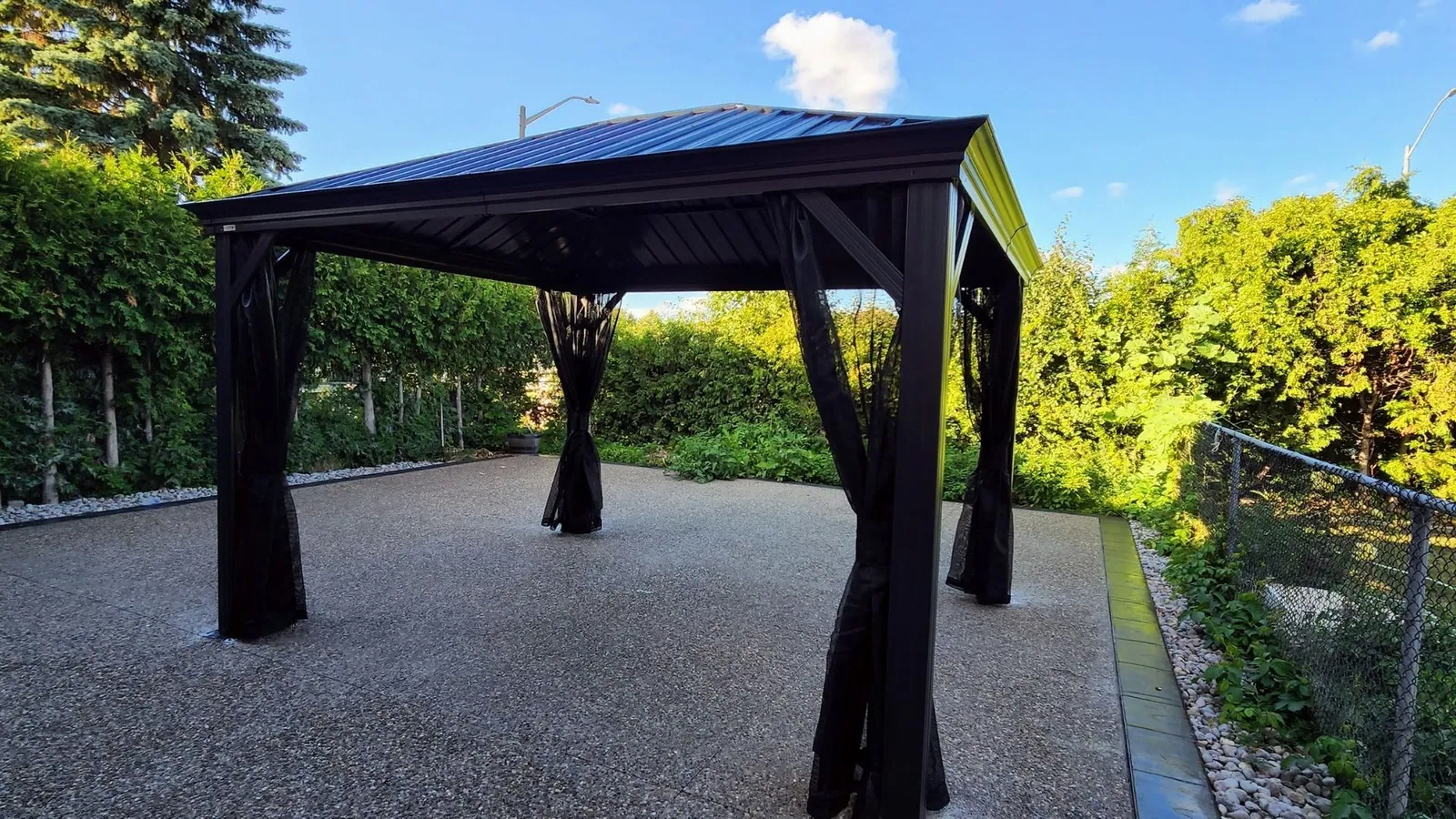 Yardistry cedar gazebo built over a patio seating area