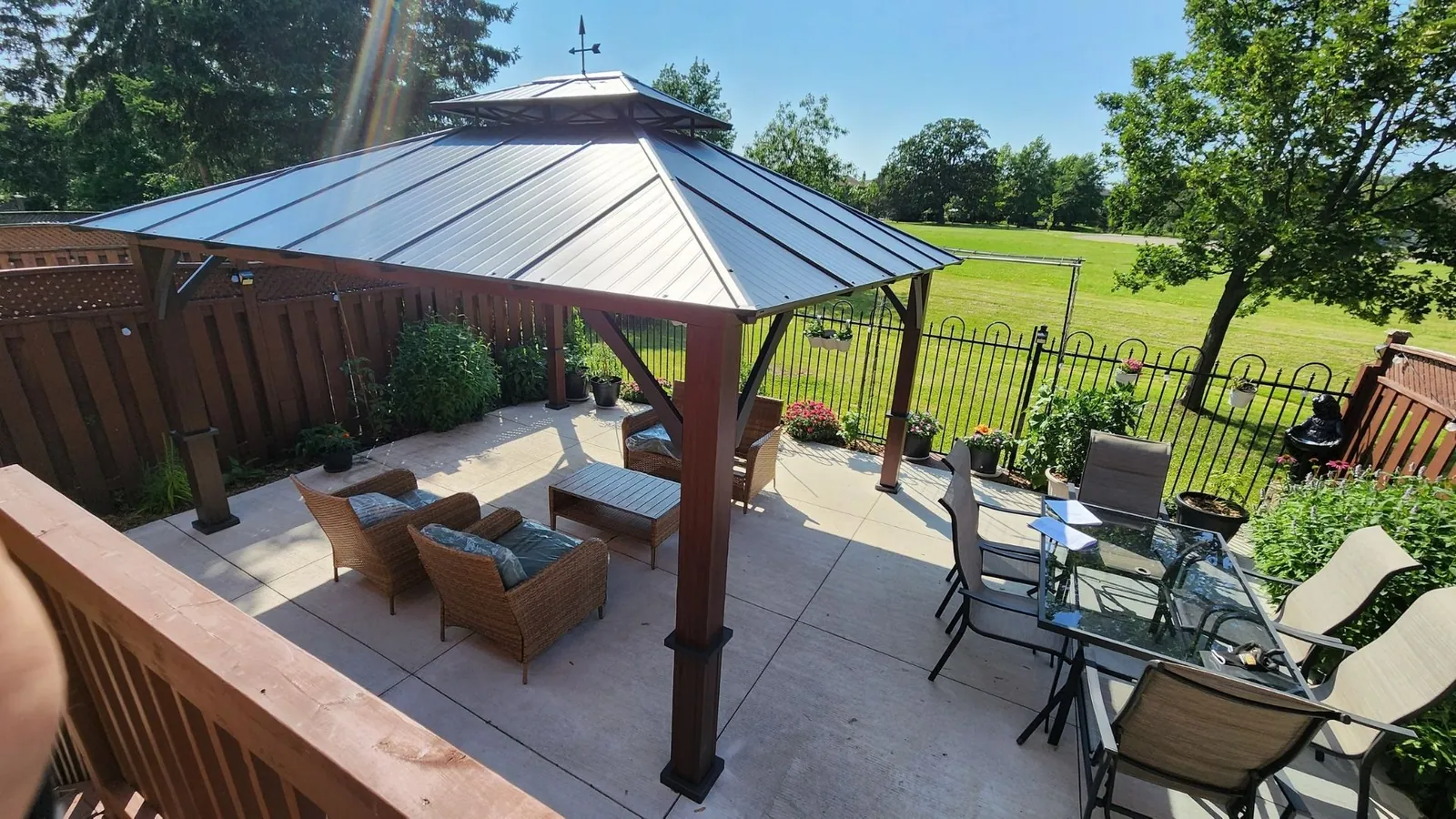 Cedar gazebo installed on a backyard deck by Helperama