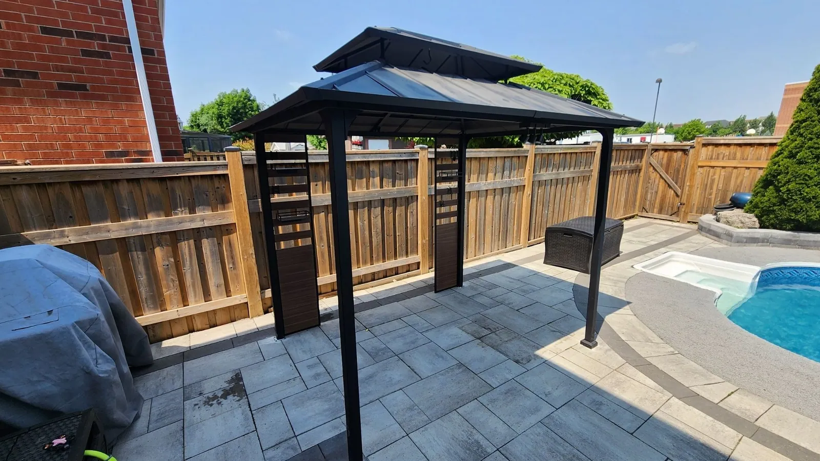 Aluminum hardtop gazebo levelled on a concrete pad