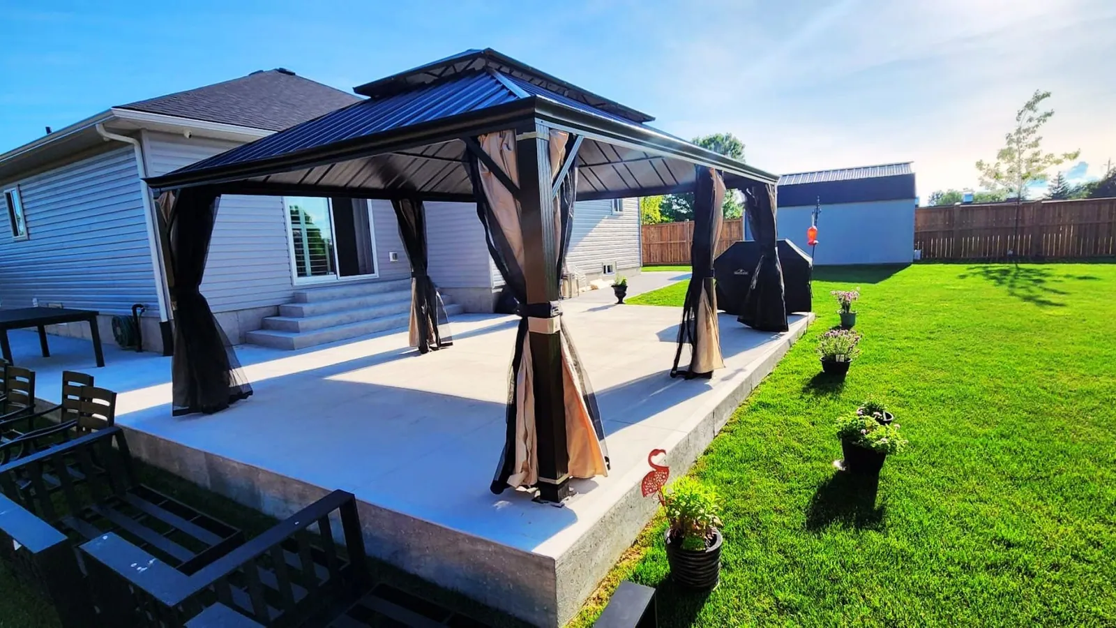 Yardistry cedar gazebo built over a patio seating area