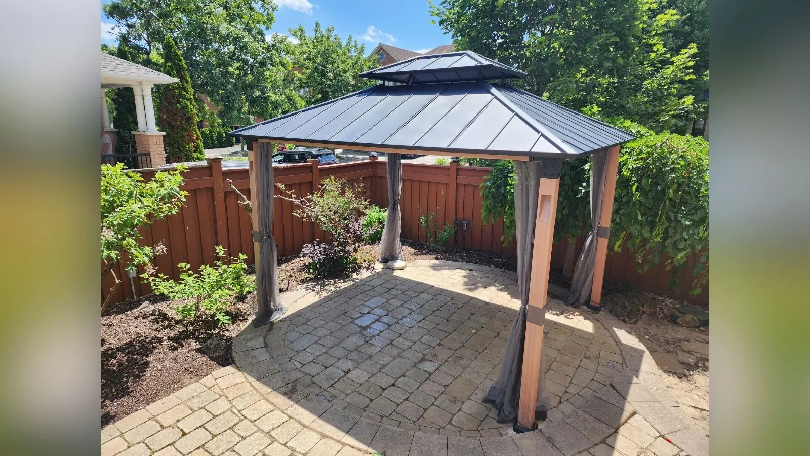 Cedar gazebo installed on a backyard deck by Helperama