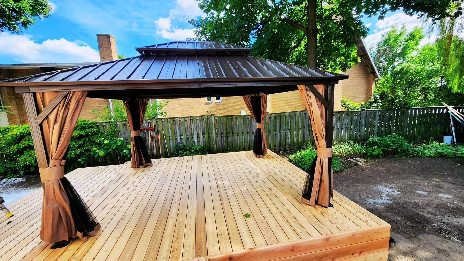 Yardistry cedar gazebo built over a patio seating area