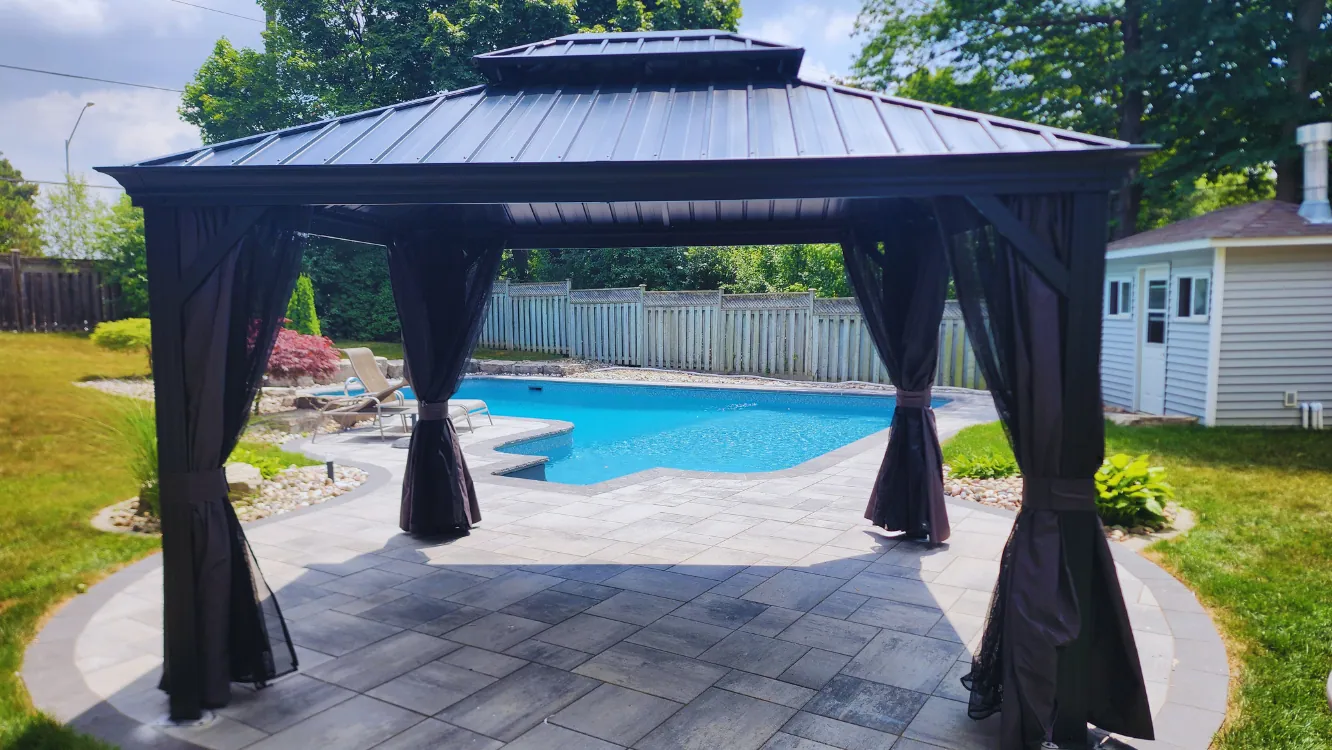 Cedar gazebo installed on a backyard deck by Helperama