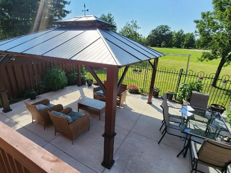 Aluminum hardtop gazebo levelled on a concrete pad