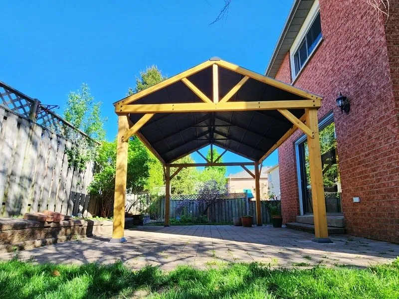 Yardistry cedar gazebo built over a patio seating area