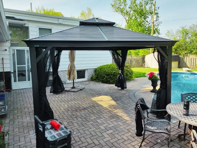 Aluminum hardtop gazebo levelled on a concrete pad