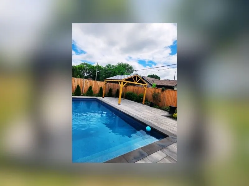 Gazebo with mosquito netting installed in a Brampton backyard