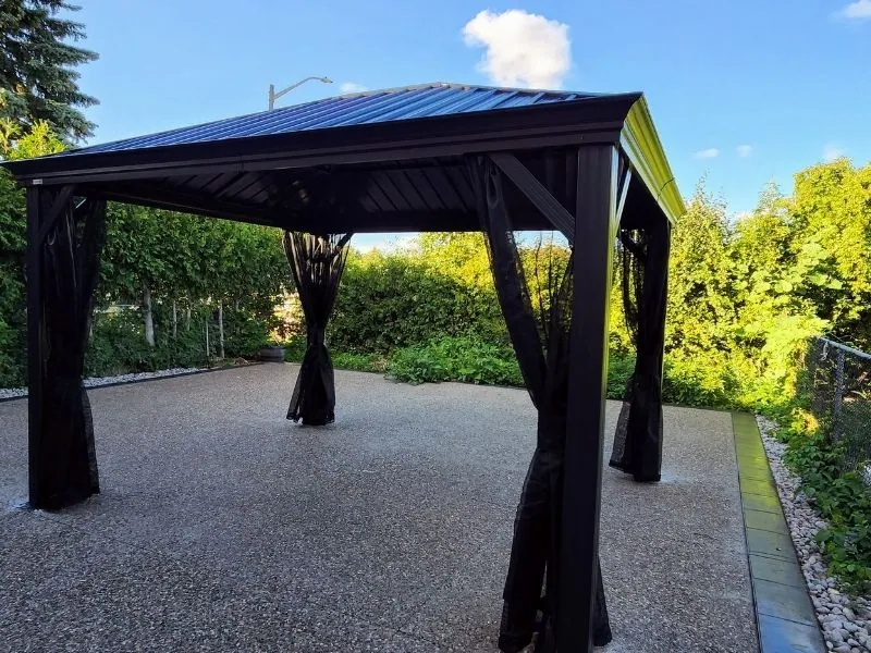 Yardistry cedar gazebo built over a patio seating area