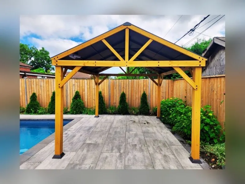 Cedar gazebo installed on a backyard deck by Helperama
