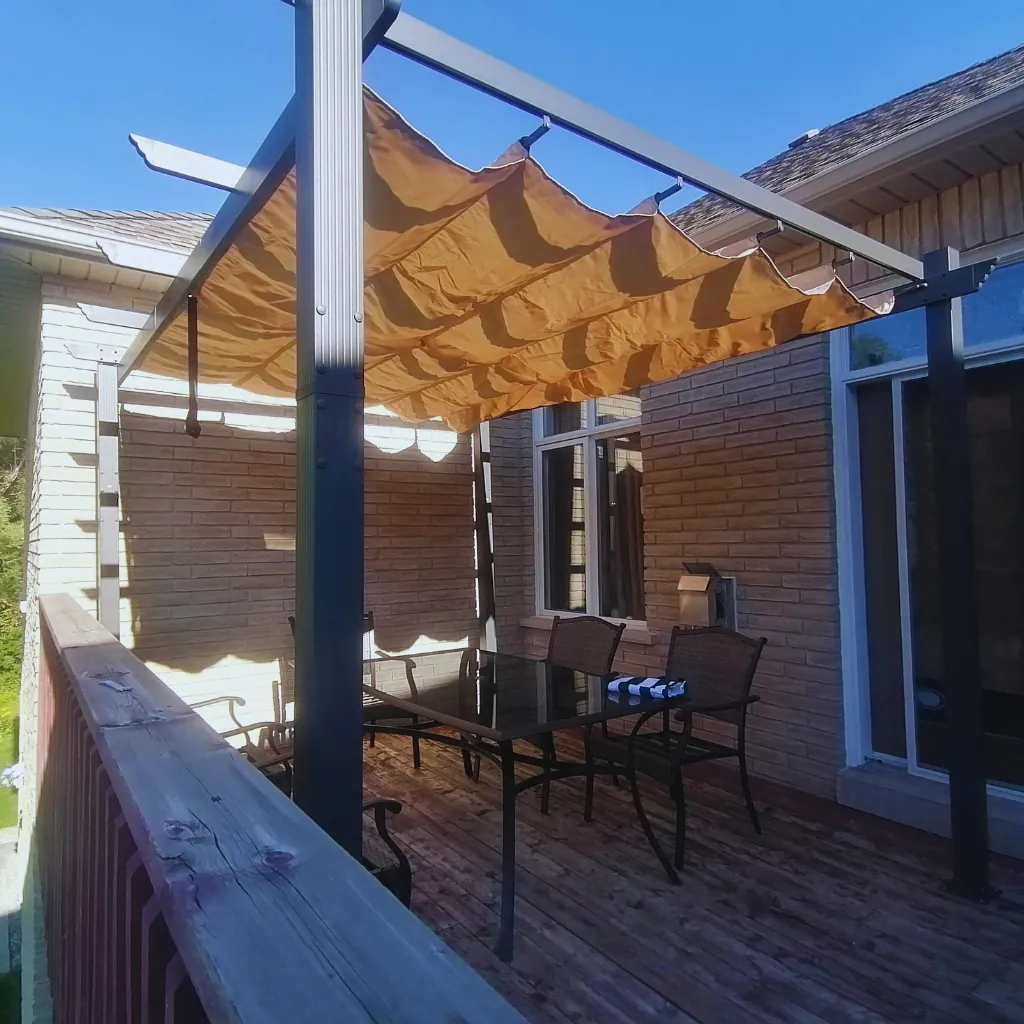 White wood pergola assembled over a paver seating area