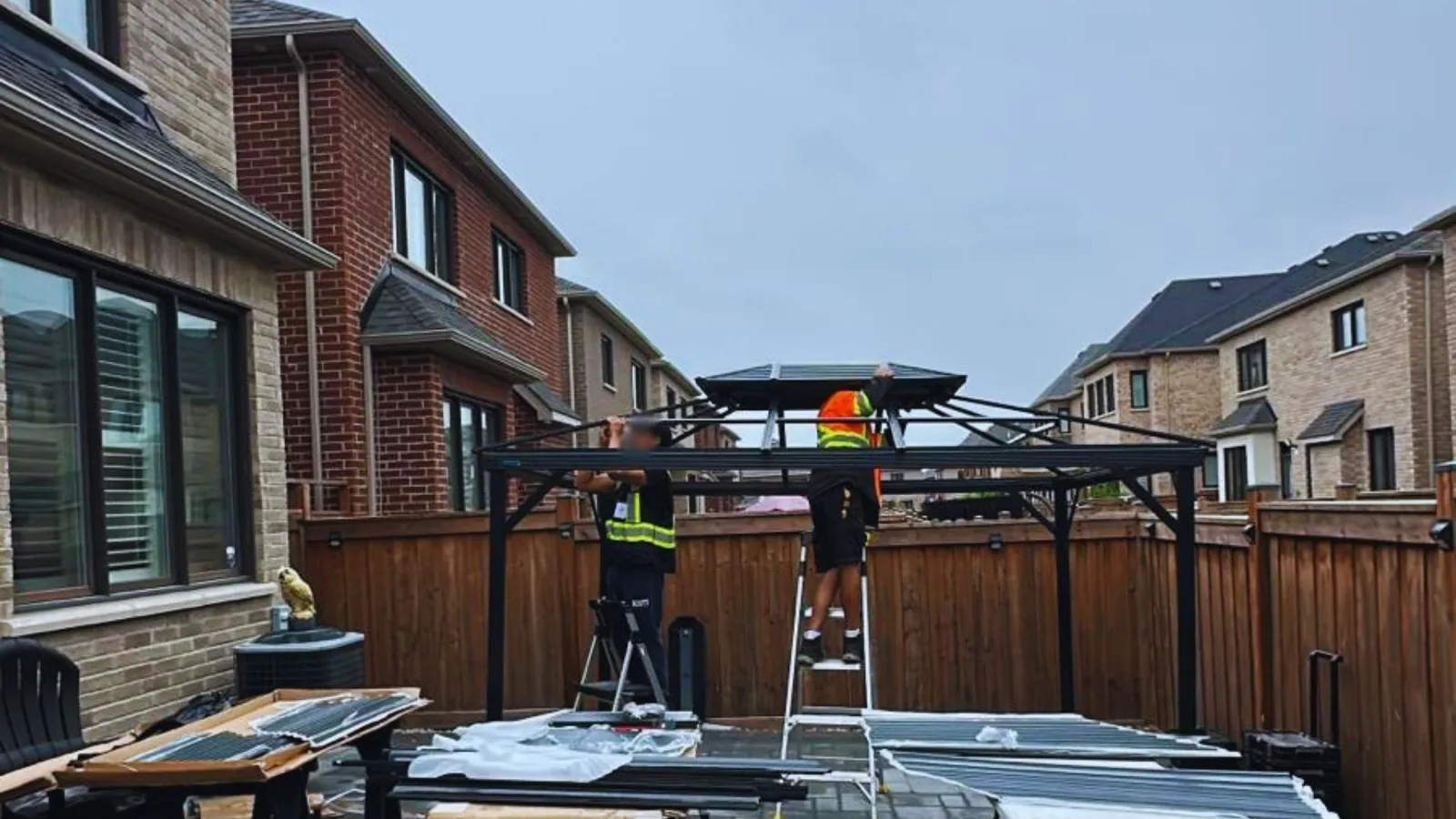 Crew building a wood shed base on site