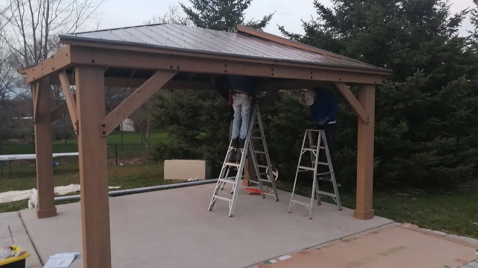 Team assembling an outdoor structure in winter conditions