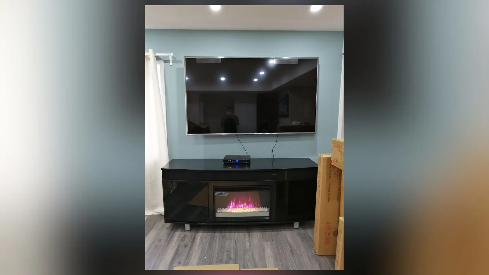 TV mounted above a mantel with the wiring hidden