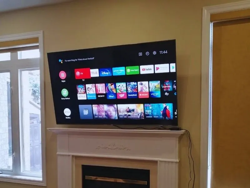 Flat-screen TV mounted level on a living room wall