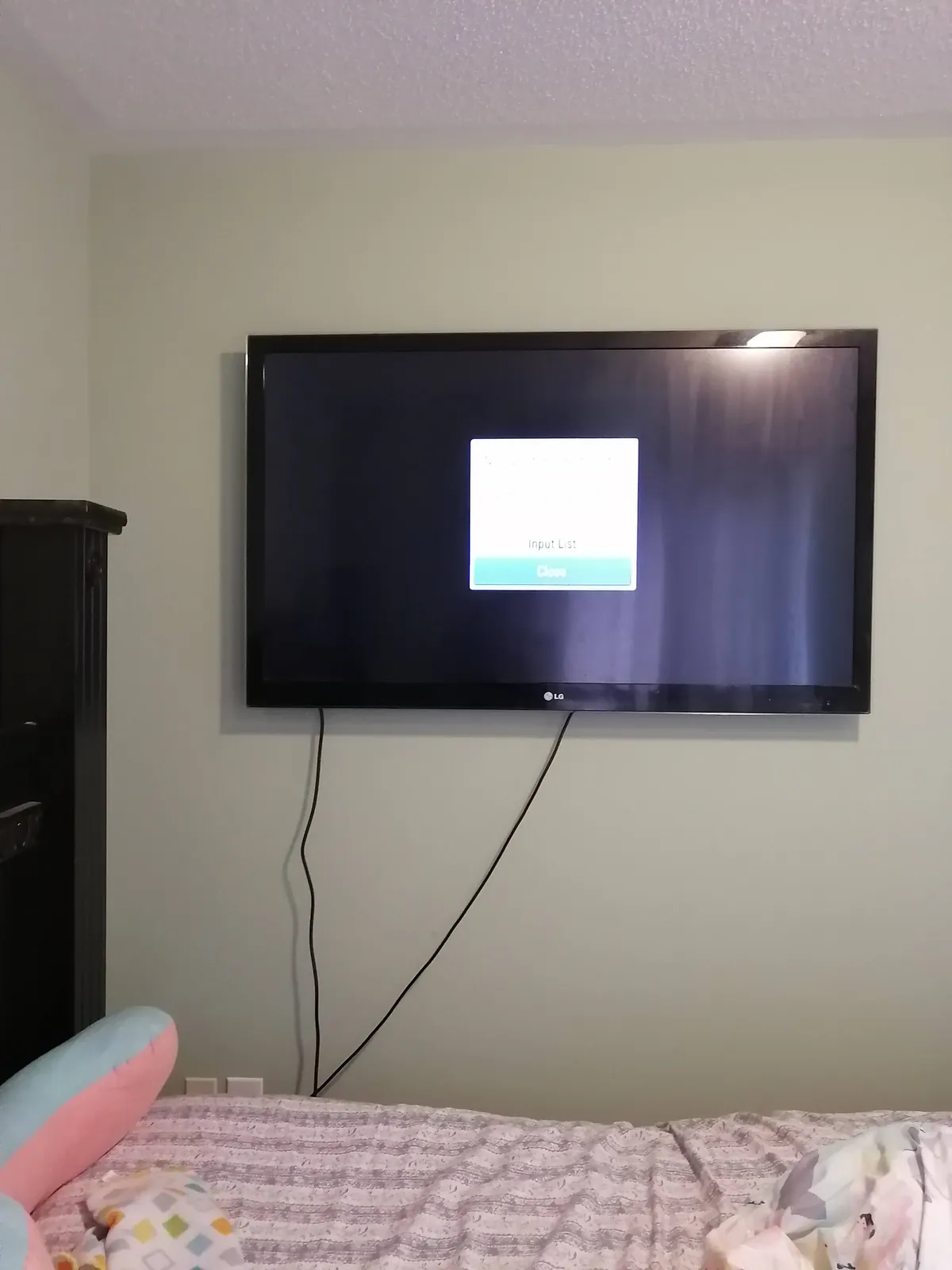 Full-motion TV mount fitted and tested on drywall