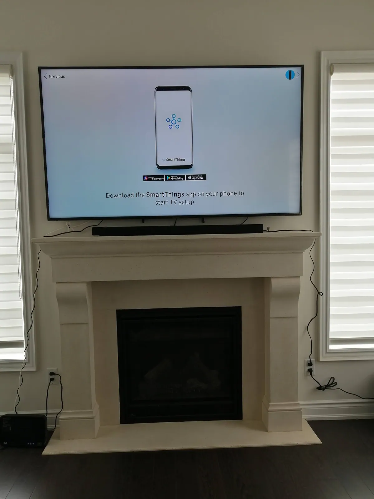 TV mounted above a mantel with the wiring hidden