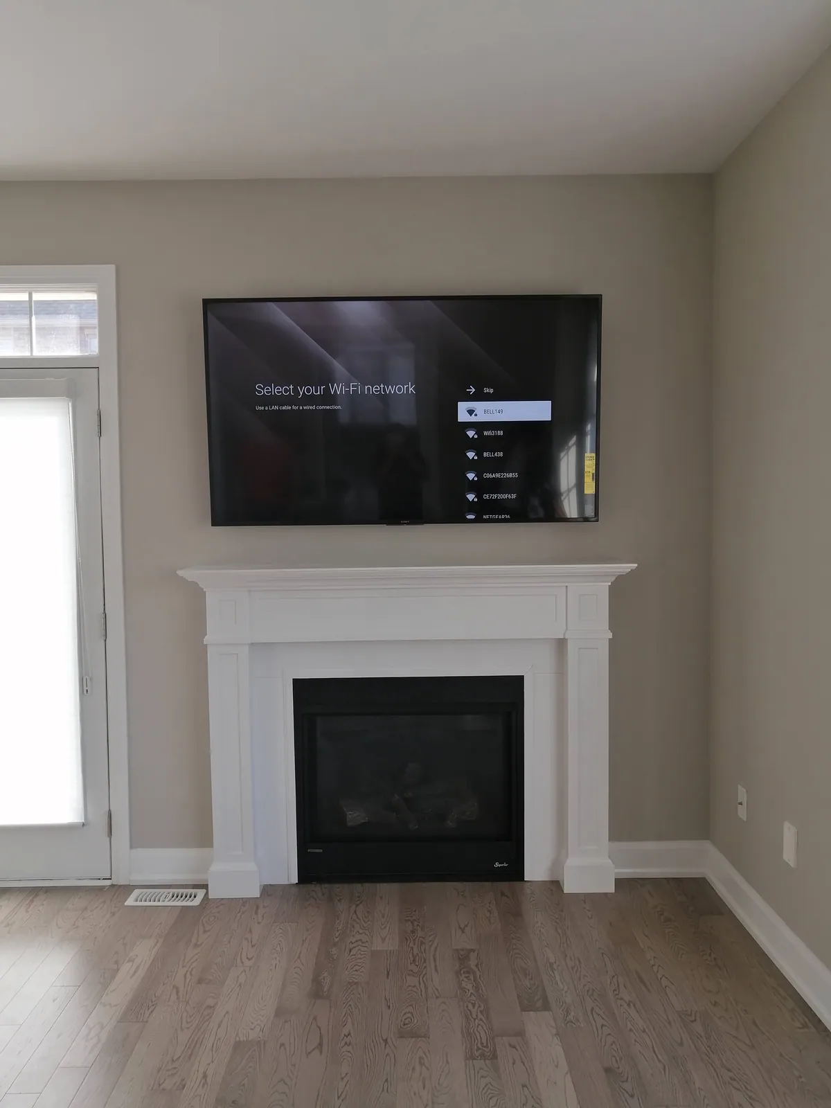 Wall-mounted television installed in a GTA home