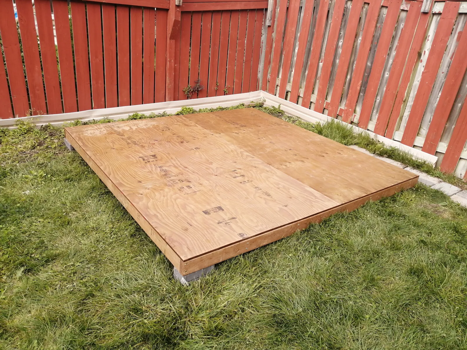 Shed base frame set out before the structure goes on