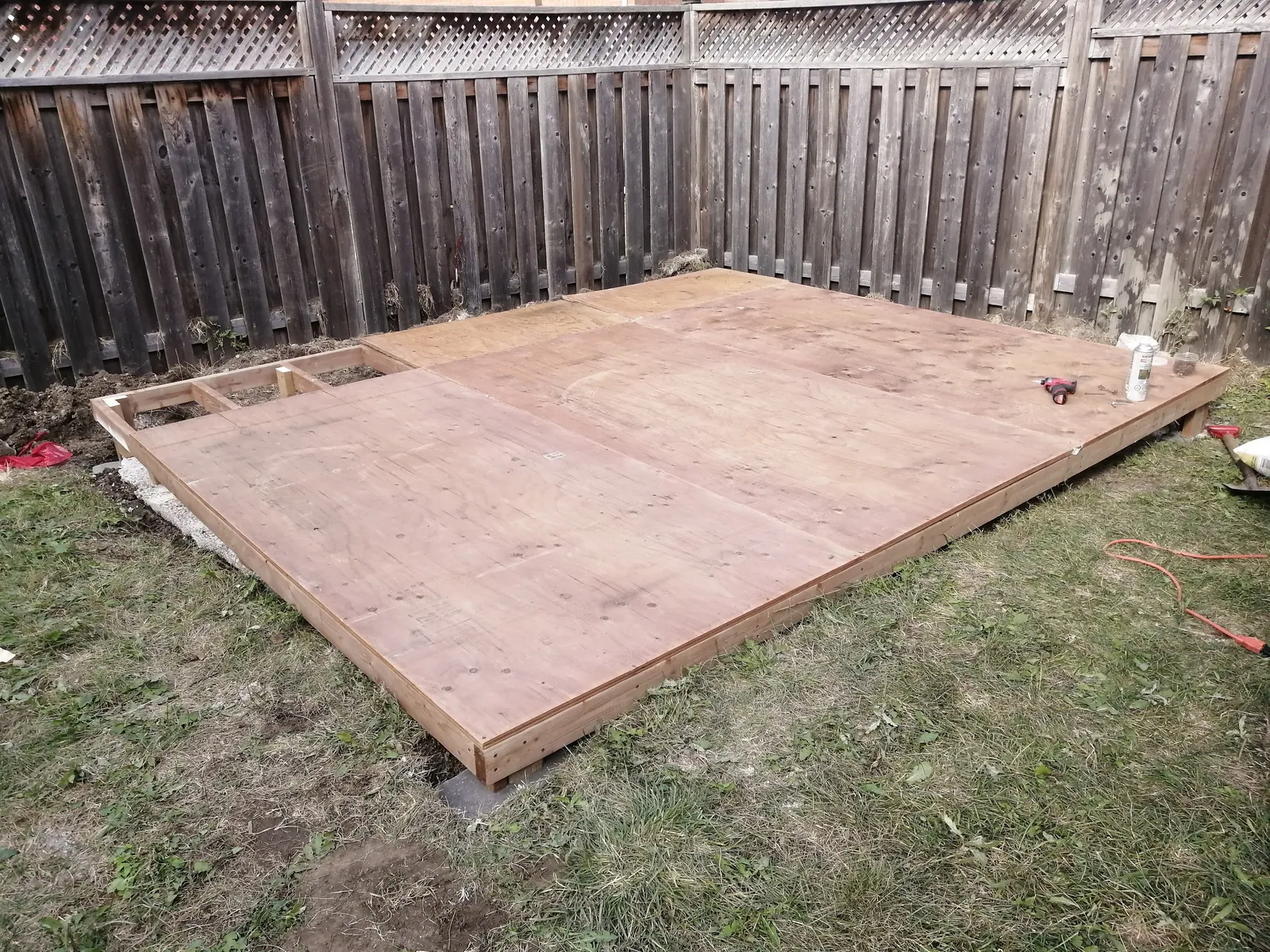 Pressure-treated wood base framed and levelled for a shed
