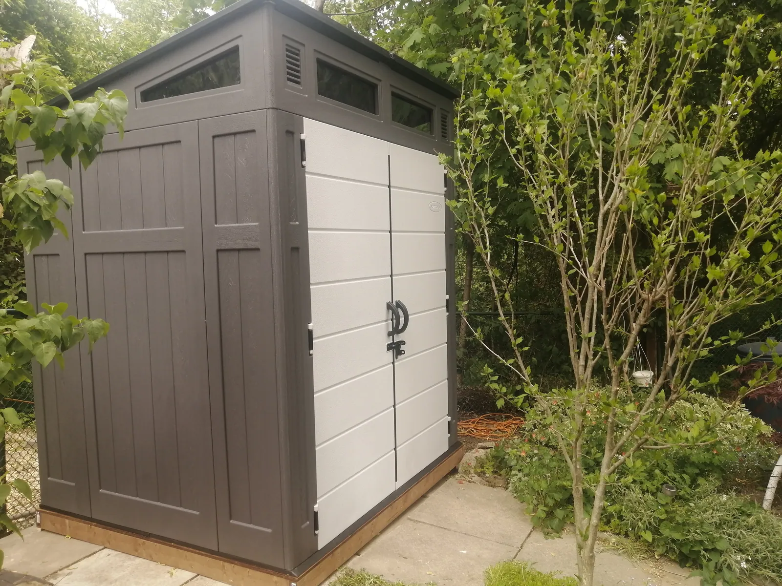 Wood shed foundation built level on sloping ground